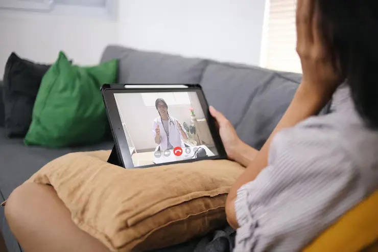 doctor talking with patient online consulting laptop home digital consultation telehealth